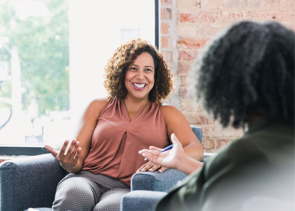 Two people in a supportive one to one conversation